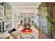Entryway with a grand table, hardwood floors, and abundant natural light, creating a welcoming and sophisticated ambiance at 614 Lake Ave, Orlando, FL 32801