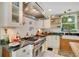 Modern kitchen with stainless steel appliances, subway tile backsplash, and open shelving at 614 Lake Ave, Orlando, FL 32801