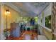 Bright laundry room featuring a washer, dryer, painted mural and gleaming hardwood floors at 614 Lake Ave, Orlando, FL 32801