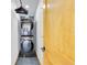 Modern laundry room featuring stacked washer and dryer with a light wood door at 614 Lake Ave, Orlando, FL 32801