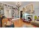 Living room with a fireplace, a bookshelf wall, and a large patterned mirror at 614 Lake Ave, Orlando, FL 32801