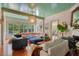 Spacious living room featuring light-colored walls, hardwood floors, a fireplace, and oversized window at 614 Lake Ave, Orlando, FL 32801