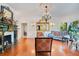 Charming living room with a fireplace, beautiful hardwood floors, and stylish furnishings offers a cozy atmosphere at 614 Lake Ave, Orlando, FL 32801