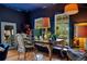 Stylish home office with a large desk, ample natural light, and dark blue walls at 614 Lake Ave, Orlando, FL 32801