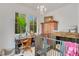 Bright office space with a wooden desk, large window, and unique pet nook at 614 Lake Ave, Orlando, FL 32801