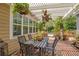 Outdoor patio with pergola, brick flooring, and lush greenery, perfect for entertaining at 614 Lake Ave, Orlando, FL 32801