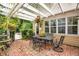 Charming brick patio with pergola, dining set, and beautiful plants at 614 Lake Ave, Orlando, FL 32801