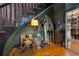 Dark winding staircase with polished wood floors and a decorative mirror at 614 Lake Ave, Orlando, FL 32801