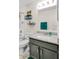 Modern bathroom with granite vanity, chrome faucet, and a shower, blending style with functionality at 6527 Silver Queen Way, Windermere, FL 34786