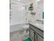 Modern bathroom with subway tile shower, granite vanity, and glass door providing natural light at 6527 Silver Queen Way, Windermere, FL 34786