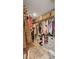Organized walk-in closet with ample storage shelves, hanging rods, and stylish storage boxes at 6527 Silver Queen Way, Windermere, FL 34786