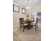 Charming dining area featuring a round table, comfortable chairs, and modern light fixture at 6527 Silver Queen Way, Windermere, FL 34786