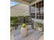 Cozy front porch featuring rocking chairs, a decorative rug, and potted plants for a relaxing outdoor space at 6527 Silver Queen Way, Windermere, FL 34786