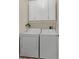 Functional laundry area with white washer, dryer, and overhead cabinets, maximizing storage space at 6527 Silver Queen Way, Windermere, FL 34786