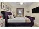 Elegant main bedroom featuring a plush bed, chic decor, and a comfortable window seat with natural light at 6527 Silver Queen Way, Windermere, FL 34786