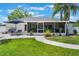 Expansive backyard featuring a screened patio and ample green space at 719 Stevelynn Cir, Winter Garden, FL 34787