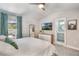 Comfortable bedroom with neutral tones, a ceiling fan, a window and an ensuite bathroom at 719 Stevelynn Cir, Winter Garden, FL 34787