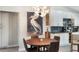 Dining area showcasing modern pendant lighting, wooden table and chairs, and elegant decor at 719 Stevelynn Cir, Winter Garden, FL 34787