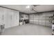 Organized garage with built-in storage cabinets and ample space at 719 Stevelynn Cir, Winter Garden, FL 34787