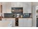 Stylish kitchen with a bar, modern appliances, wooden countertop, and a wine wrack at 719 Stevelynn Cir, Winter Garden, FL 34787