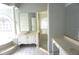 Bathroom showcasing a luxurious tub, walk-in glass shower, and ample vanity space at 8025 Old Town Dr, Orlando, FL 32819