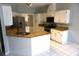 Bright kitchen featuring stainless steel appliances, granite countertops, and ample cabinet space at 8025 Old Town Dr, Orlando, FL 32819