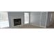 Living room features a fireplace and windows with blinds providing plenty of natural light at 8025 Old Town Dr, Orlando, FL 32819