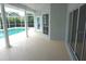 Covered patio with access to the screened pool, features a door and windows at 8025 Old Town Dr, Orlando, FL 32819