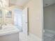Bright bathroom featuring double sinks, a walk-in shower and access to an adjacent bedroom at 8426 Sw 114Th St, Ocala, FL 34481