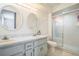 Bright bathroom with a walk-in shower, dual sinks, and ample storage in a vanity at 8426 Sw 114Th St, Ocala, FL 34481