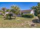 Well-maintained single-story home featuring palm trees and manicured landscaping in a serene setting at 8426 Sw 114Th St, Ocala, FL 34481