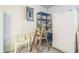 A practical laundry area with a refrigerator, utility shelving, and an open electrical panel at 8426 Sw 114Th St, Ocala, FL 34481