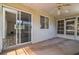 A covered patio with sliding glass doors leads to interior, extending living space at 8426 Sw 114Th St, Ocala, FL 34481