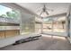 Bright sunroom with large windows offers a seamless transition to the outdoors at 8426 Sw 114Th St, Ocala, FL 34481