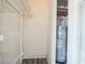 A utility closet with a water heater and shelving provides practical storage solutions at 8426 Sw 114Th St, Ocala, FL 34481