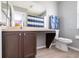 Bathroom featuring a vanity with drawers and an open view to another room at 936 Calabria Ave, Davenport, FL 33897