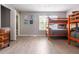 Bright bedroom featuring a bunk bed, dresser, and modern decor, perfect for or guests at 936 Calabria Ave, Davenport, FL 33897