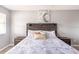Bedroom featuring a rustic bed, neutral colors, and plenty of natural light at 936 Calabria Ave, Davenport, FL 33897
