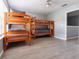 Spacious bedroom featuring two sets of wooden bunk beds and hard surface flooring at 936 Calabria Ave, Davenport, FL 33897