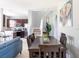 Open floor plan showing living, dining, and kitchen areas with natural light and neutral color scheme at 936 Calabria Ave, Davenport, FL 33897