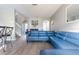 Spacious living room featuring a comfortable sectional sofa and an open floor plan at 936 Calabria Ave, Davenport, FL 33897