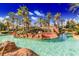 Inviting lagoon-style pool is surrounded by lush landscaping for a relaxing tropical ambiance at 936 Calabria Ave, Davenport, FL 33897