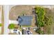 Aerial view of a home with a dark roof, fenced yard, and nearby hot tub at 999 Trumbull St, Deltona, FL 32725