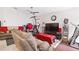 Cozy living room with comfortable seating, a ceiling fan, and a large television for entertainment at 999 Trumbull St, Deltona, FL 32725