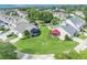 Beautiful aerial view showcasing two homes with well-manicured lawns and unique sunrooms at 104 Nautica Mile Dr, Clermont, FL 34711