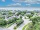 Picturesque aerial view of the community's layout, with charming homes and well-maintained landscaping at 104 Nautica Mile Dr, Clermont, FL 34711