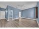 Spacious bedroom with hardwood floors, walk-in closet, and ensuite bathroom entrance at 104 Nautica Mile Dr, Clermont, FL 34711