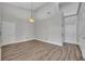 Spacious bedroom featuring light wood-look floors, a ceiling fan, and neutral walls at 104 Nautica Mile Dr, Clermont, FL 34711