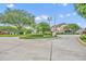 Welcoming entrance to the community with mature trees, manicured landscaping and well maintained grounds at 104 Nautica Mile Dr, Clermont, FL 34711
