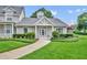 Beautiful single-story home features a pristine lawn and charming architectural details at 104 Nautica Mile Dr, Clermont, FL 34711